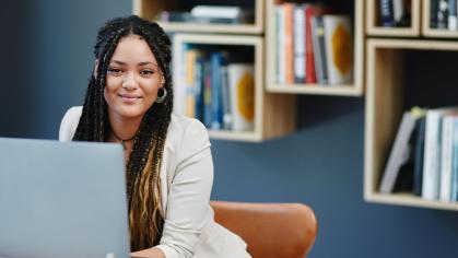 young woman by a laptop