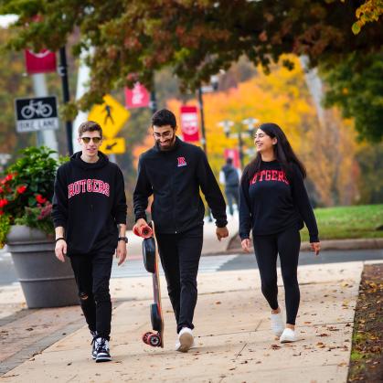Three students walking on the Livingston campus