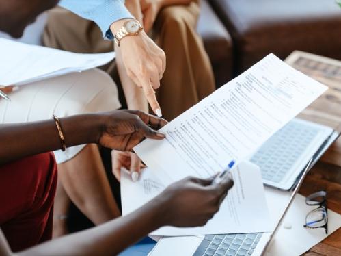 Hands holding a document 